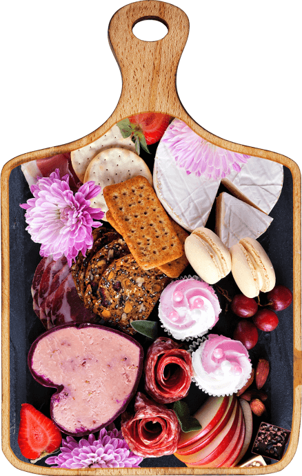 Une photo d’une planche à découper avec des aliments ayant tous des teintes roses, rouges et mauves. Le tout est placé avec une belle présentation. 